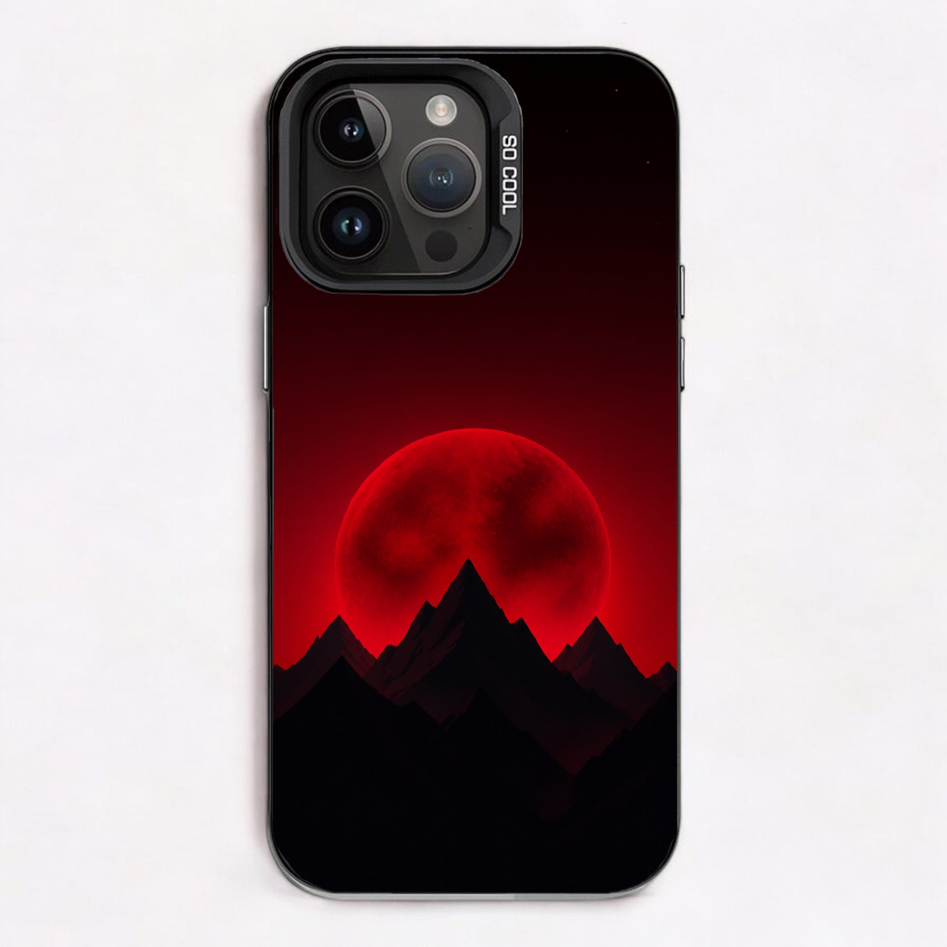 Silhouetted mountain peaks with a glowing red moon in the background, scattered stars above, dark tones overall.