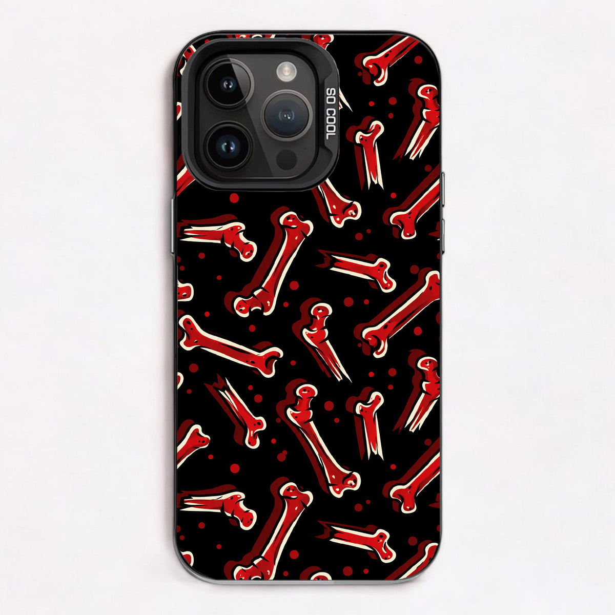 Red bones and small red dots on a black background, creating a spooky pattern.