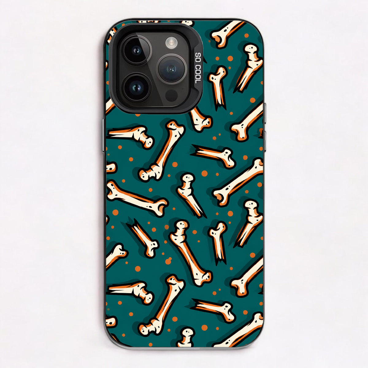 Cartoon bones on a teal background with orange polka dots, creating a playful and spooky design.