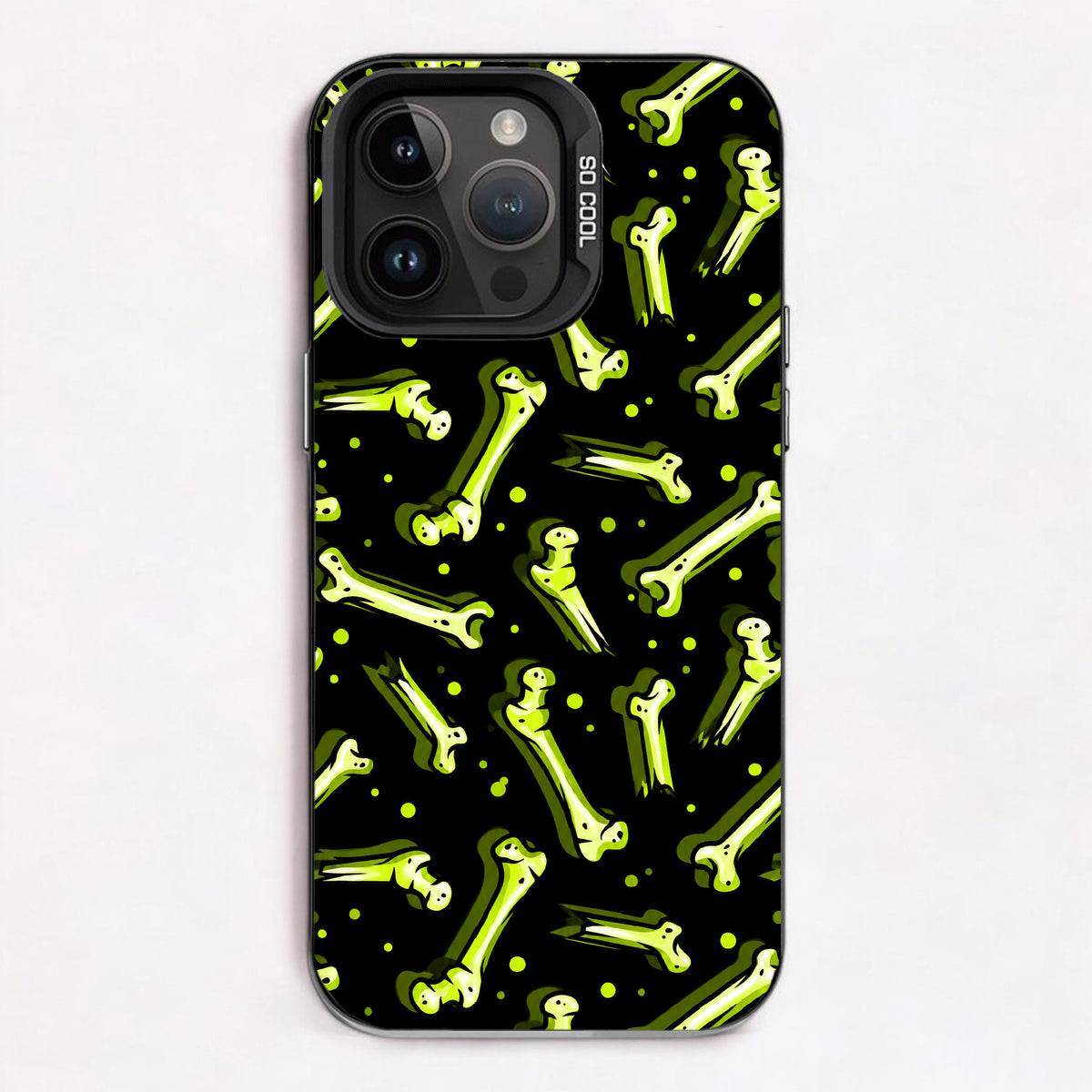 Vibrant green skeleton bones on a black background with small glowing green dots.