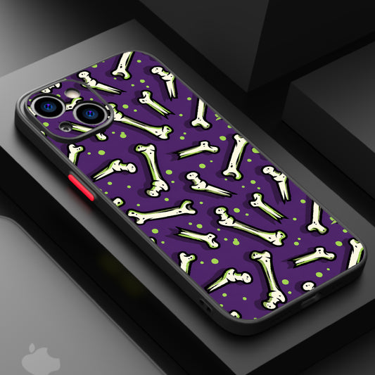 Repeating pattern of cartoon bones on a purple background with green highlights.