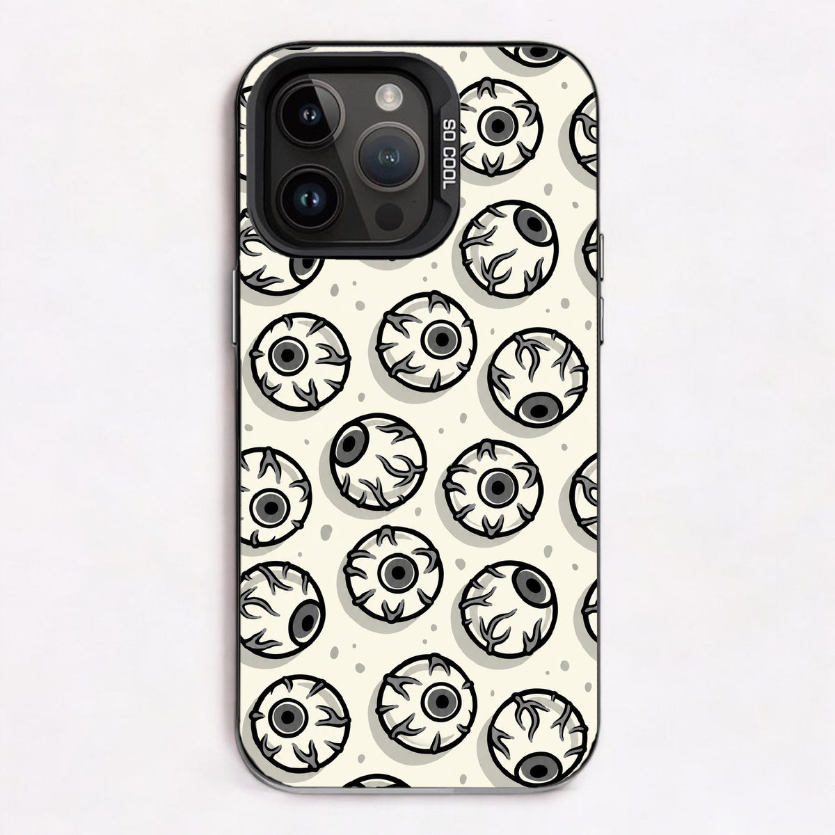 Repeating pattern of cartoonish eyes in black and white, creating a spooky and eerie mood.