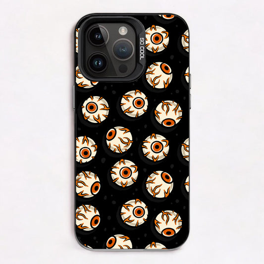Repeating pattern of cartoonish eyes with orange and black accents on a black background.