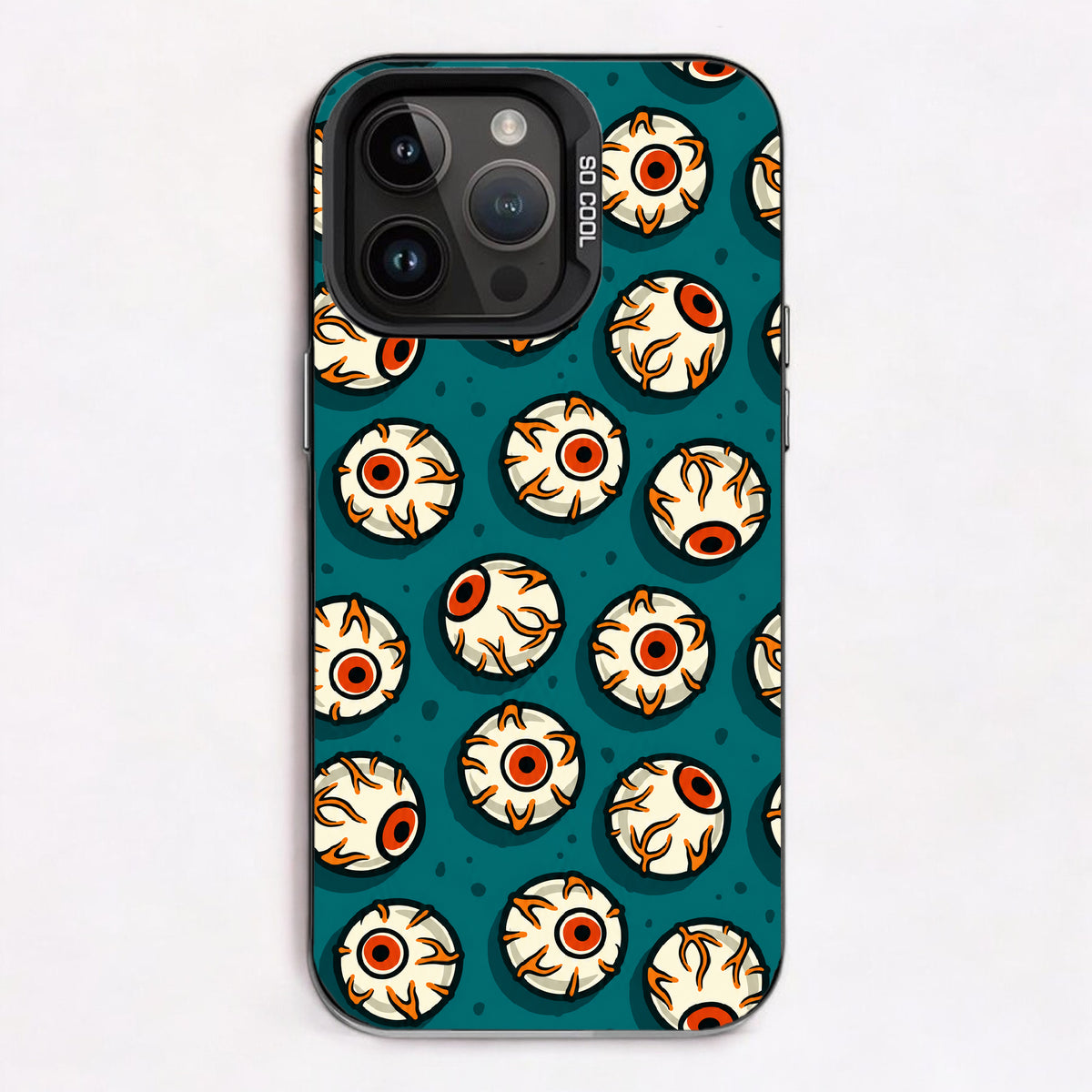 Repeating pattern of cartoonish eyes with orange and black details on a teal background.