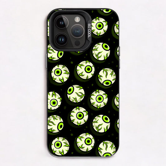 Repeating pattern of cartoonish, glowing green eyes with black pupils on a dark background.