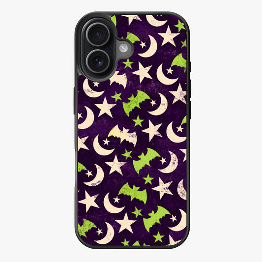 Whimsical night-themed pattern with bats, crescent moons, and stars in purple, green, and white on a dark background.