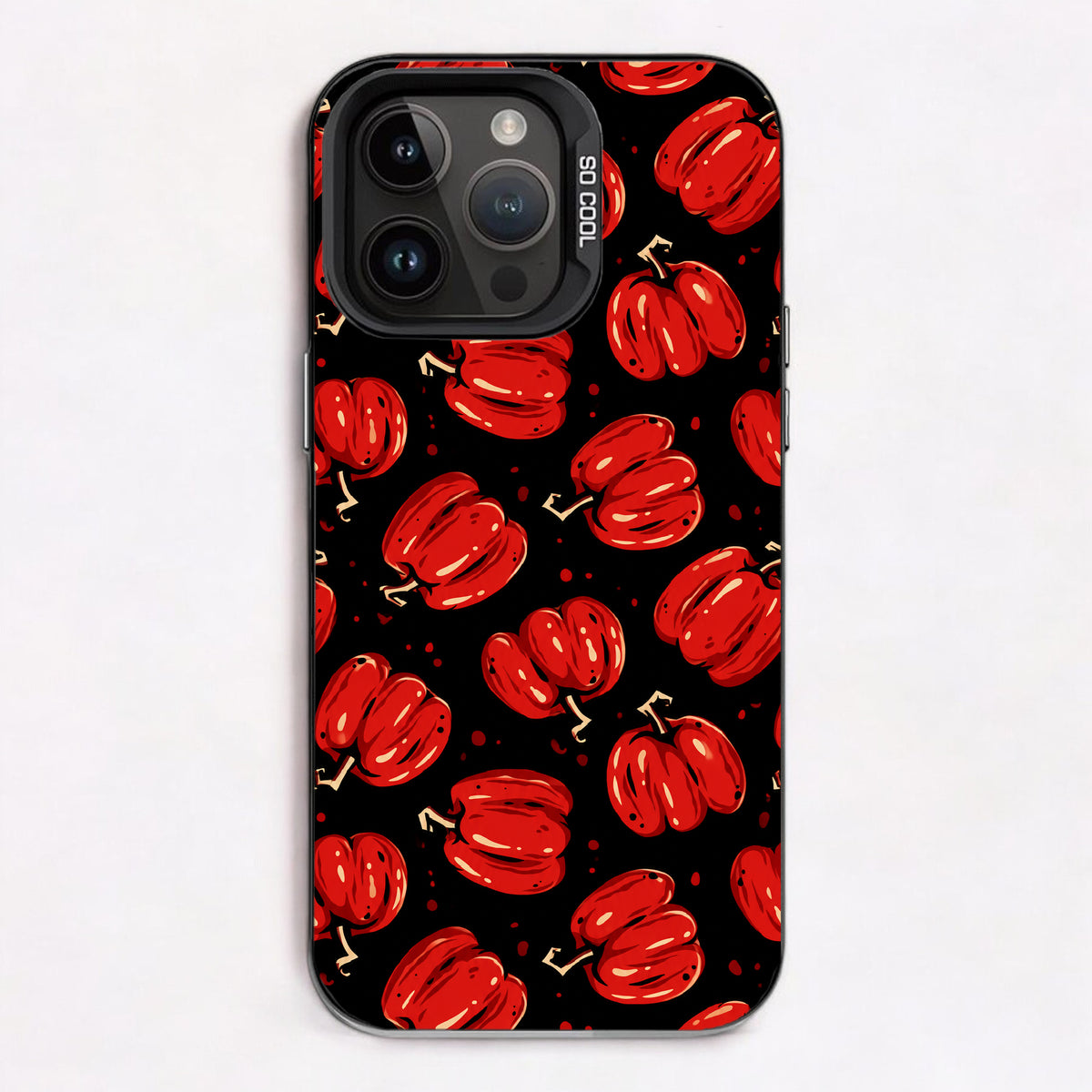 Repeating pattern of red pumpkins on a black background, evoking a spooky Halloween theme.