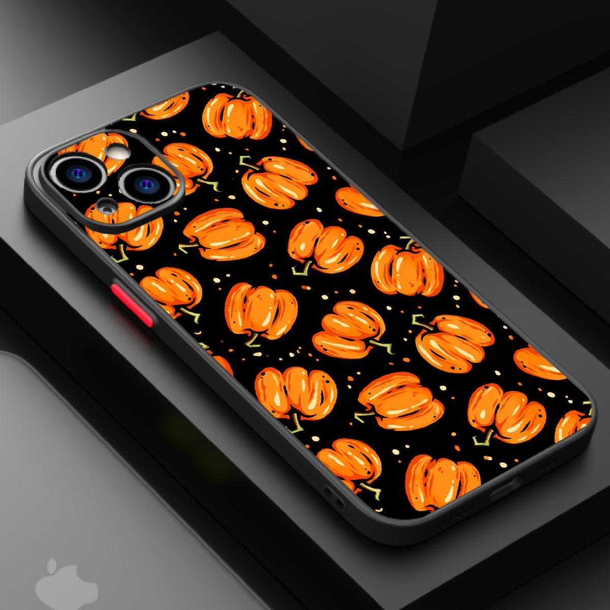 Repeating pattern of orange pumpkins with green stems on a black background, evoking a classic trick-or-treat theme.