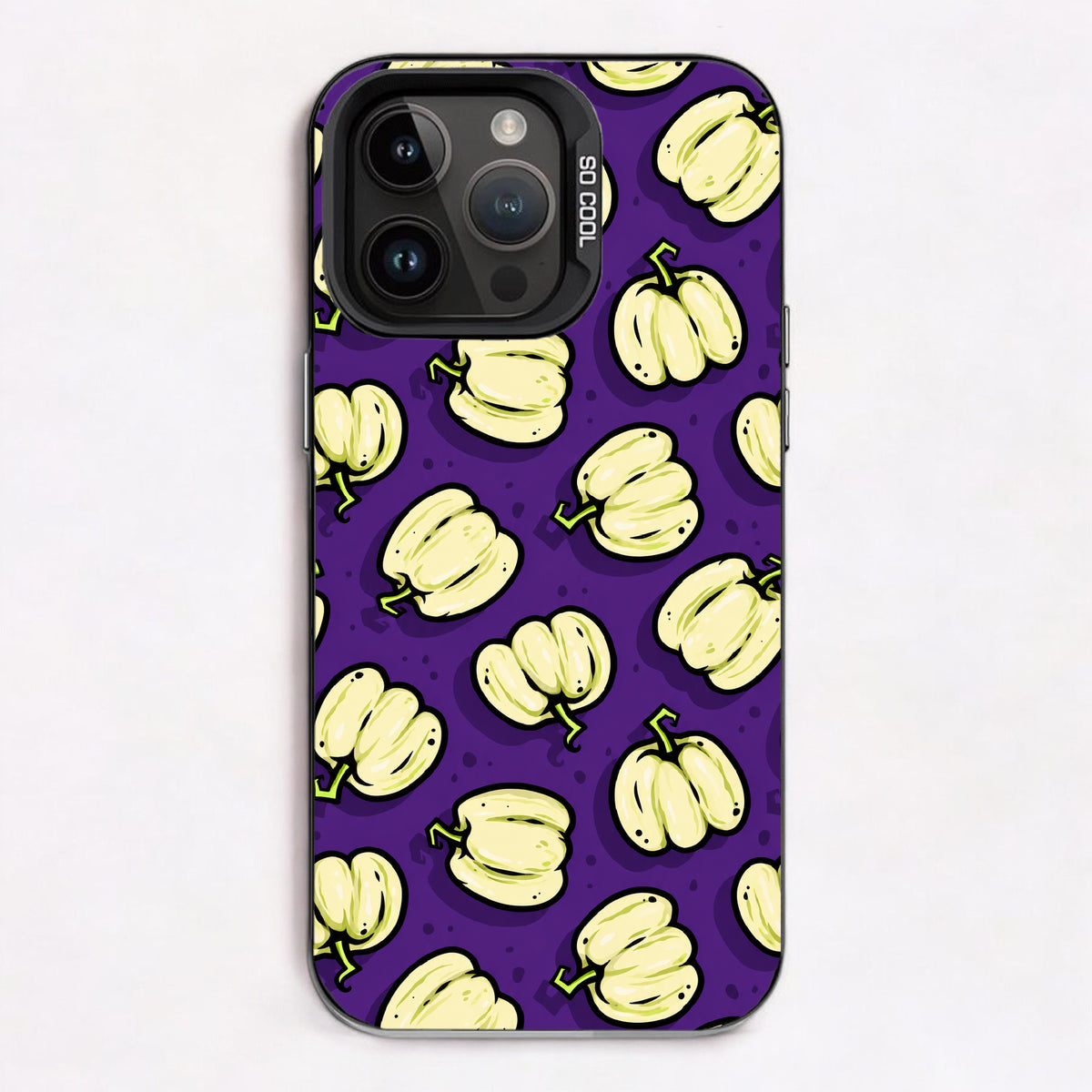 Repeating pattern of cartoon pumpkins on a witchy purple background.
