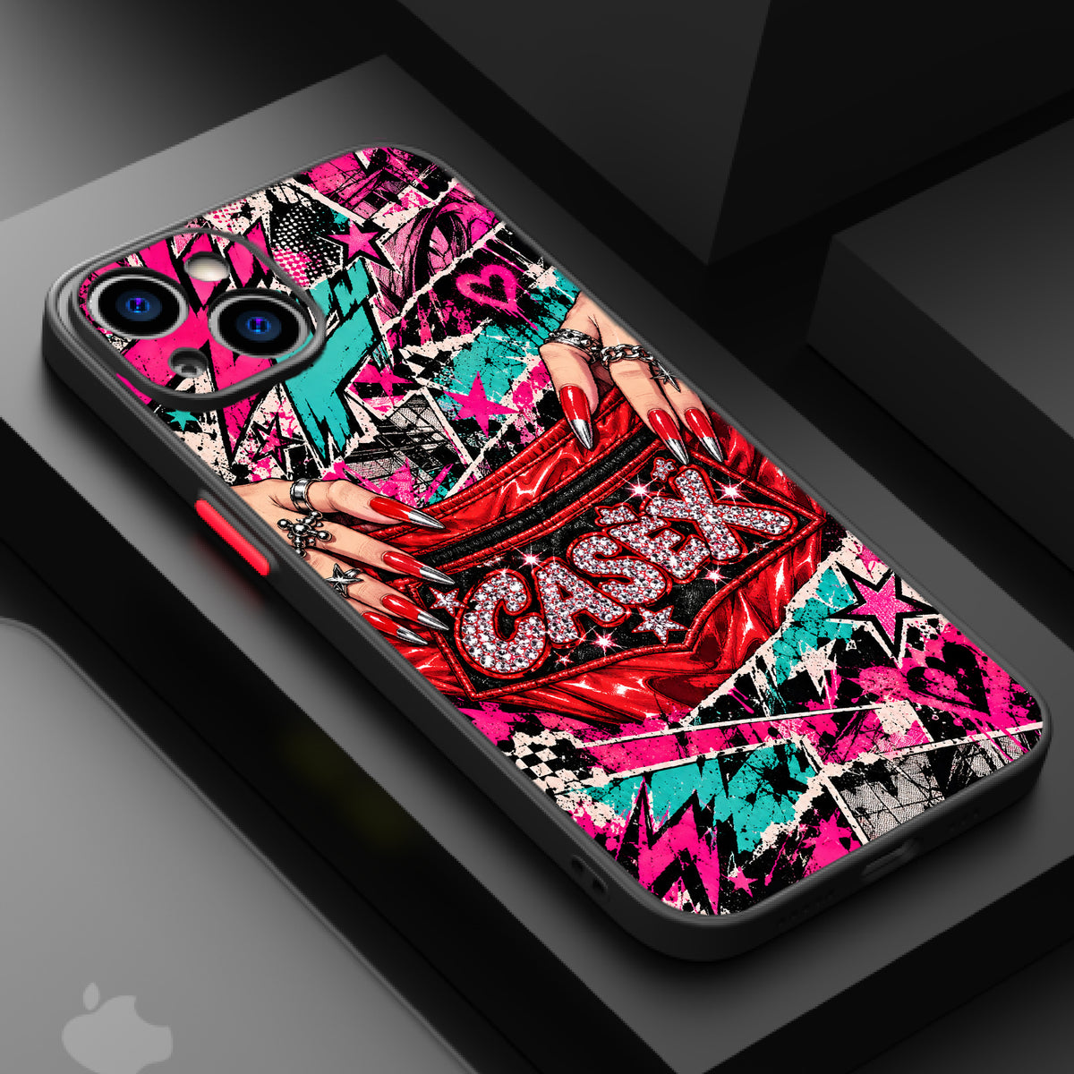 Vibrant comic book-style artwork with red rhinestones, hands with red nails, silver rings, and bold text on a phone case.