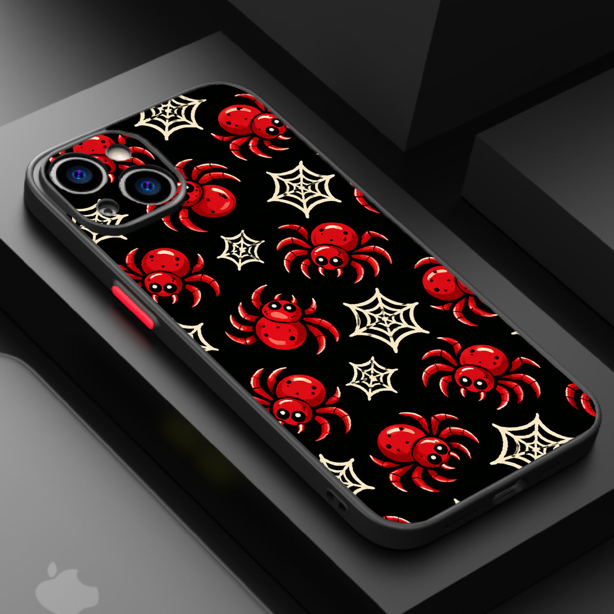 A black background with red spiders and white spider webs in a playful, Halloween-themed pattern.