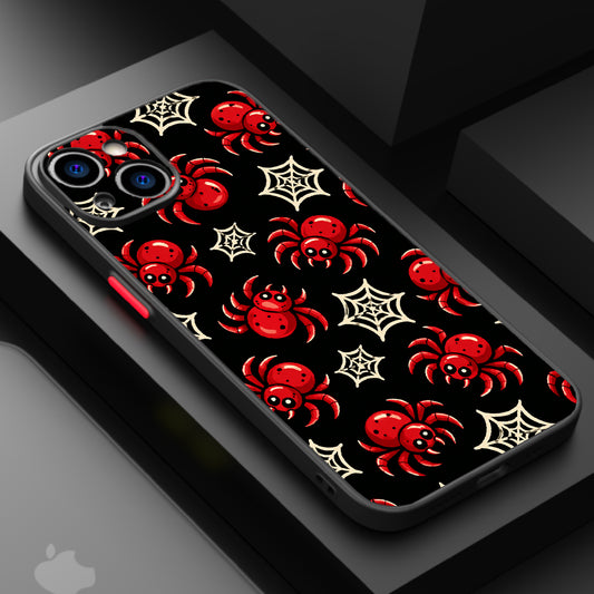 A black background with red spiders and white spider webs in a playful, Halloween-themed pattern.