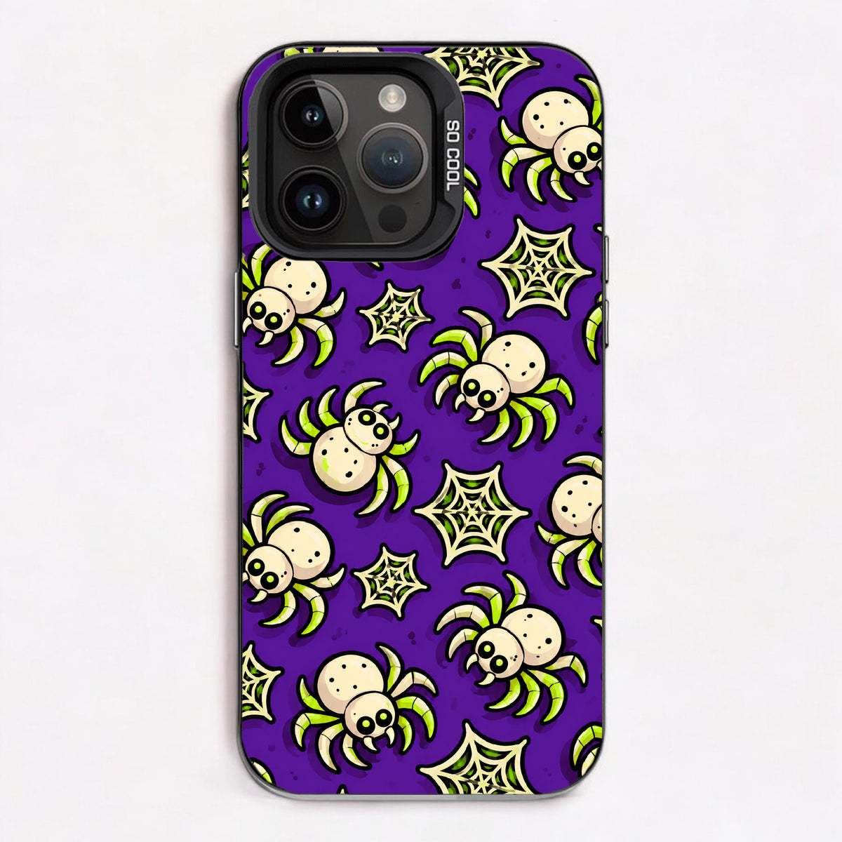 Cartoon spiders and spider webs in green and white on a purple background.